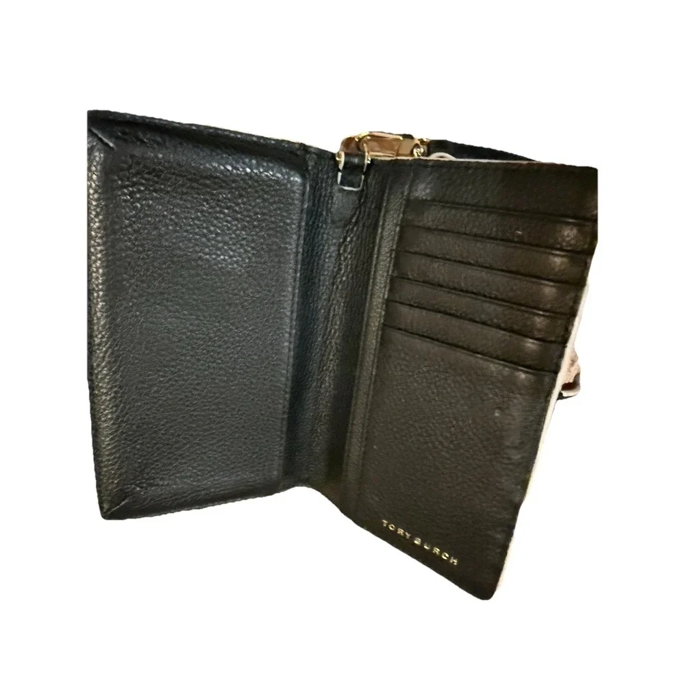Tory Burch Fret-T wallet Wrislet on a Black & White Lace Cut Out Zip Around